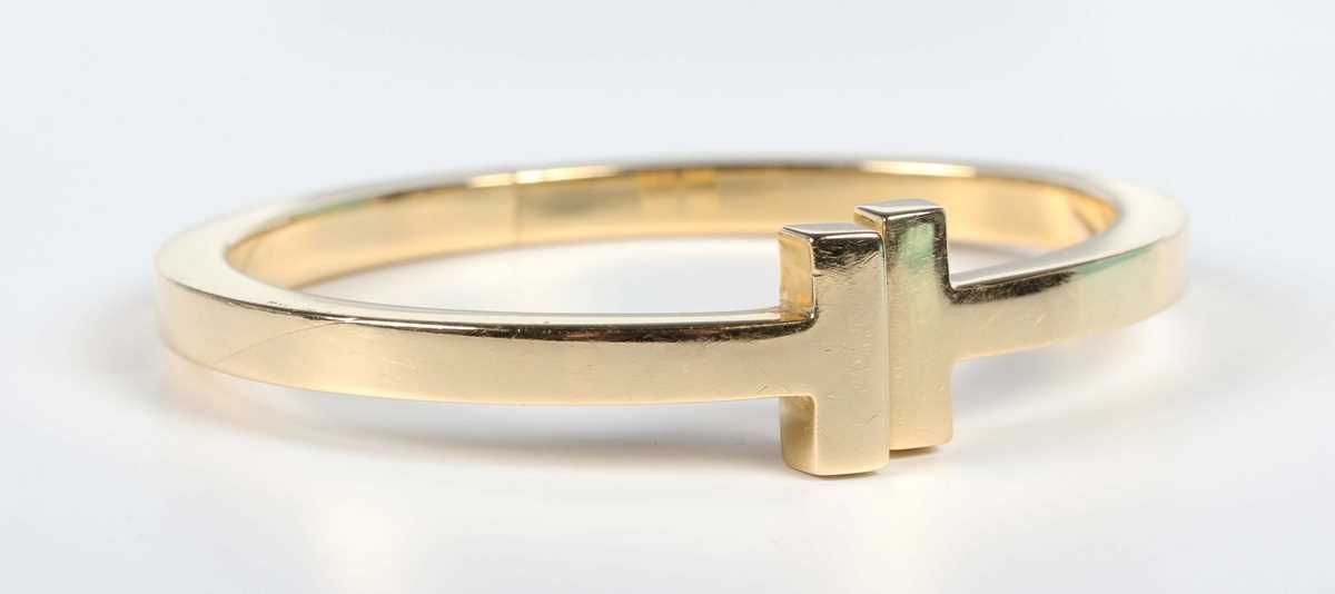 A Tiffany & Co gold 'Tiffany T Collection' square hinged bracelet, detailed ‘Tiffany & Co Au 750’,