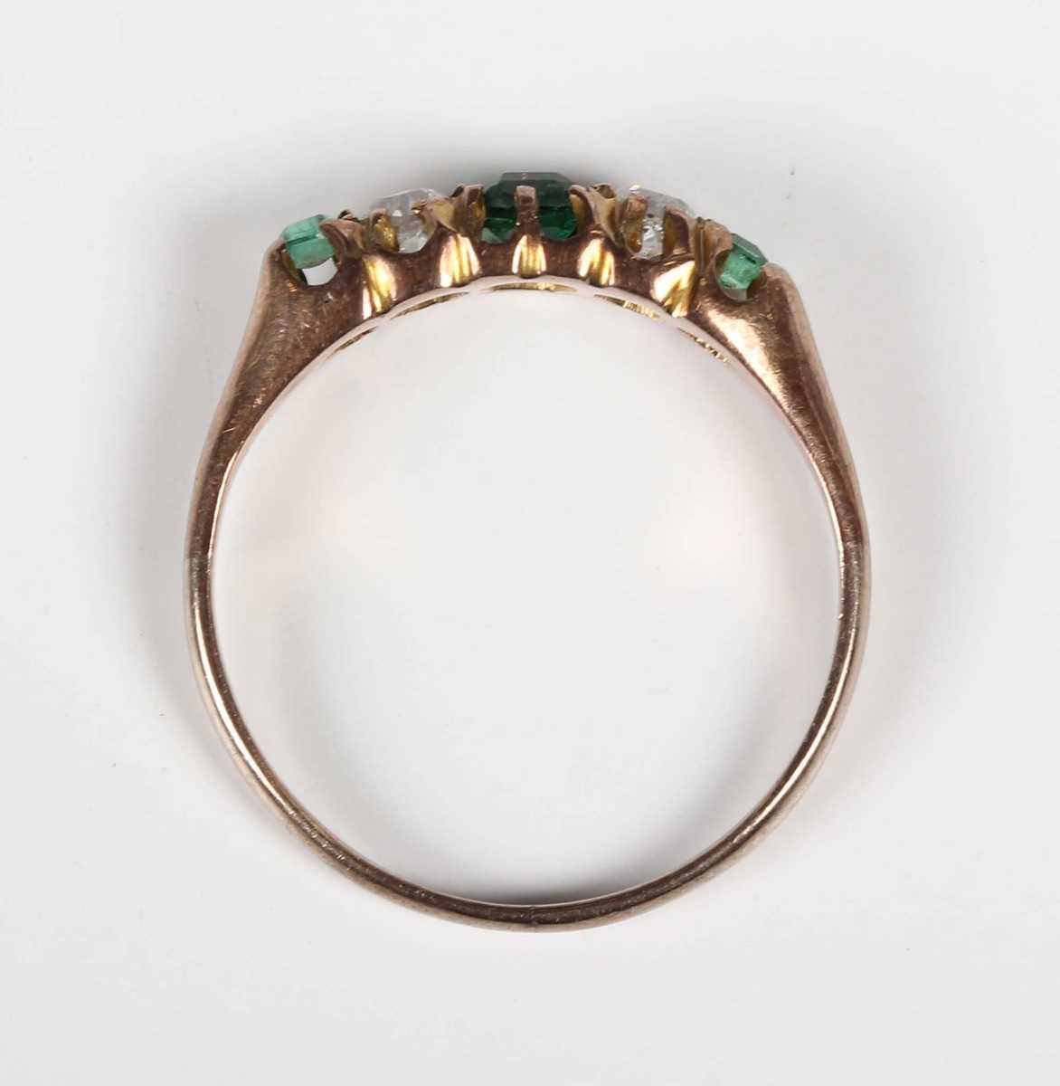 A gold, diamond and green gem set ring, mounted with two old cut diamonds between three green - Image 4 of 5