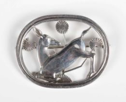A Georg Jensen silver brooch, designed by Arno Malinowski as a deer with stylised flowers within