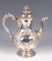 A George IV Scottish silver baluster coffee pot, the domed lid with foliate finial above a cast band