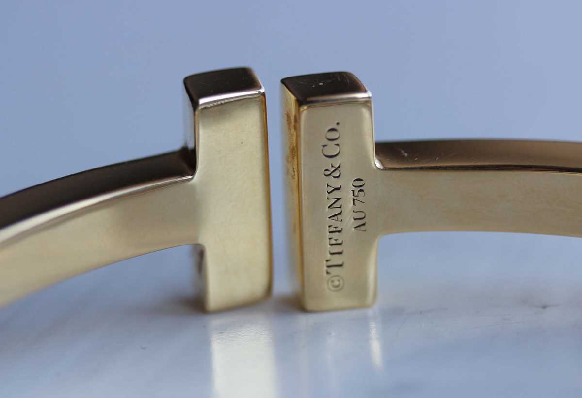 A Tiffany & Co gold 'Tiffany T Collection' square hinged bracelet, detailed ‘Tiffany & Co Au 750’, - Image 6 of 6