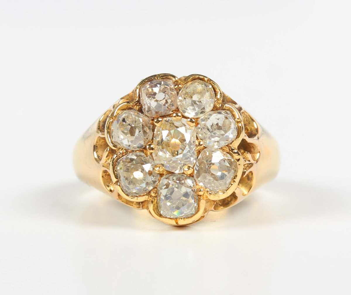 A gold and diamond cluster ring, claw set with a central old mine cut diamond within a surround of - Image 2 of 5
