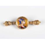 A gold and enamelled brooch, circa 1900, the centre mounted with an enamelled portrait of a