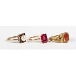 A Victorian gilt metal and cornelian signet ring, ring size approx O1/2, a gold, garnet and