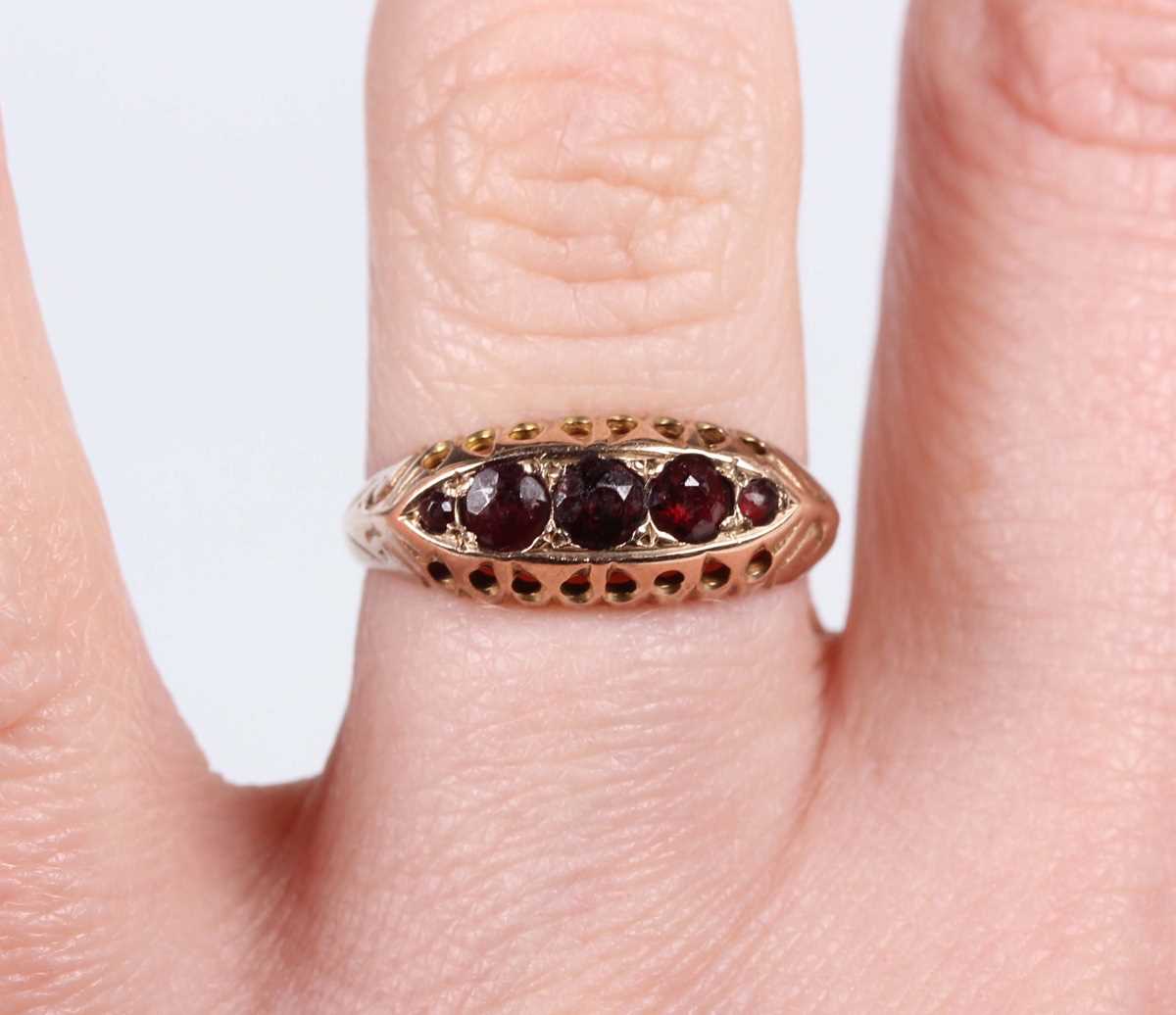 A 9ct gold and garnet five stone ring in a boat shaped design, Chester 1920, weight 1.7g, ring - Image 5 of 5