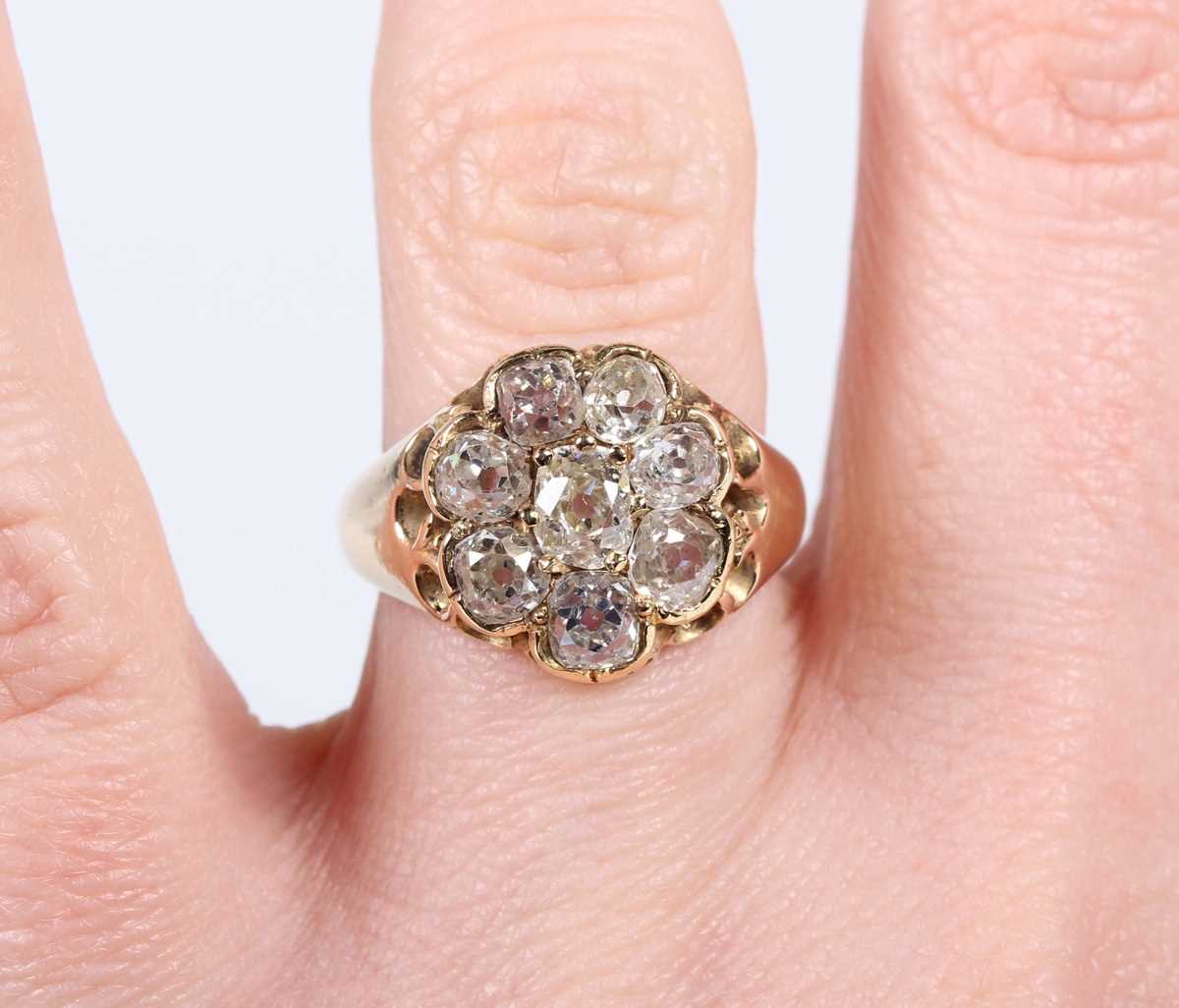 A gold and diamond cluster ring, claw set with a central old mine cut diamond within a surround of - Image 5 of 5