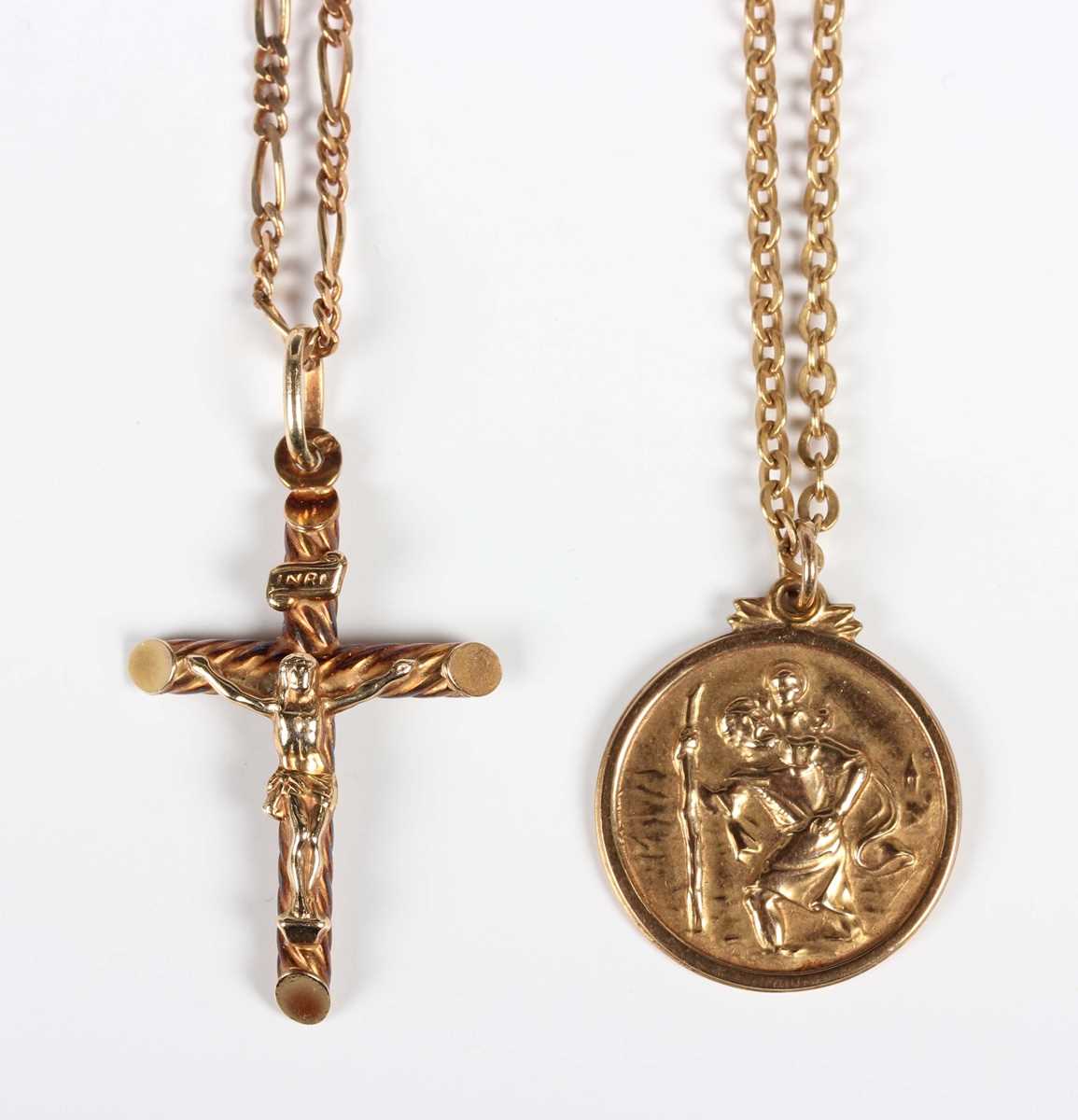 A 9ct gold pendant crucifix, length 3.9cm, with a 9ct gold Figaro link neckchain on a boltring