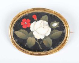 A gold and pietre dure oval brooch in a floral design, 19th century, the mount decorated with an