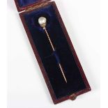 A gold and silver, diamond and baroque pearl stickpin, 19th century, the single pearl fitted to a