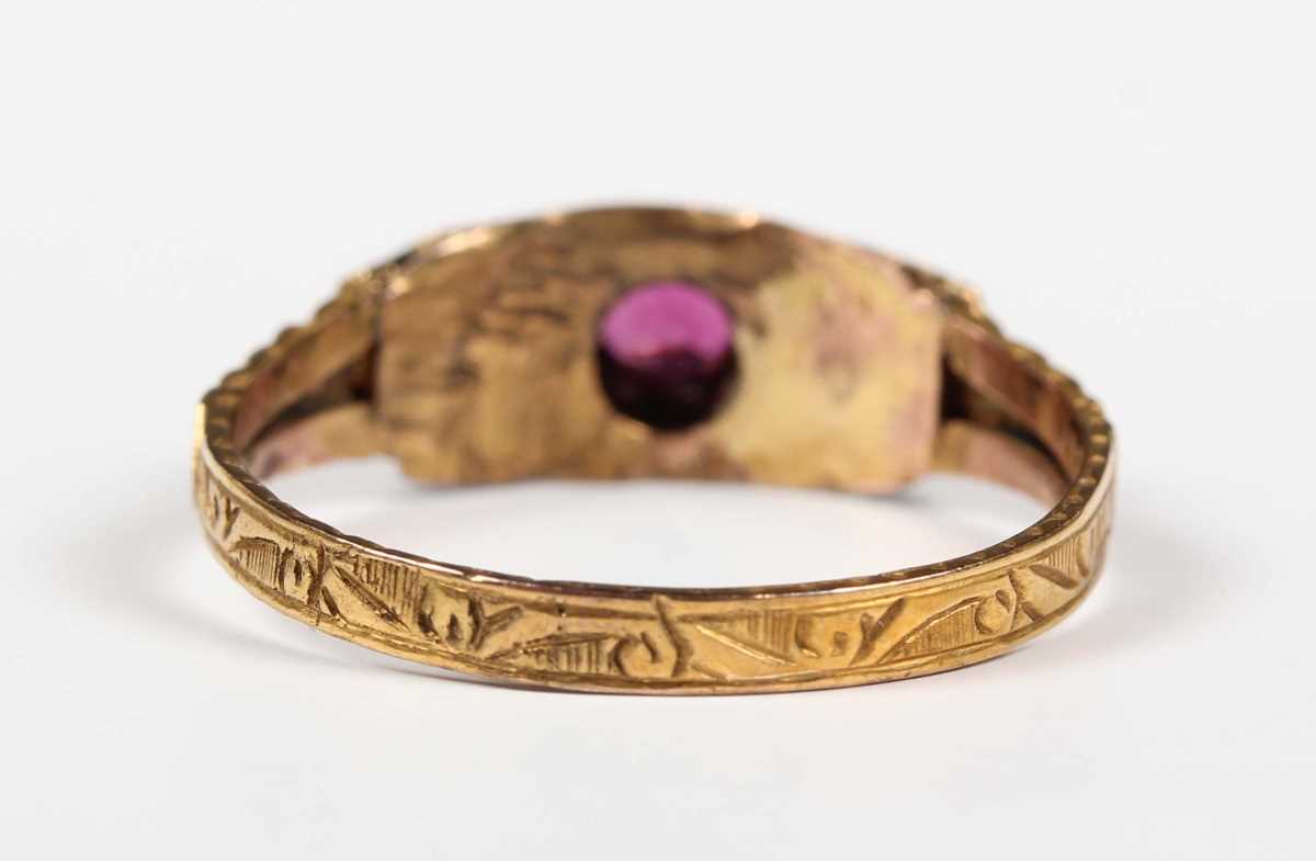A Victorian 15ct gold, garnet and half-pearl ring, mounted with three cushion cut garnets between - Image 4 of 6