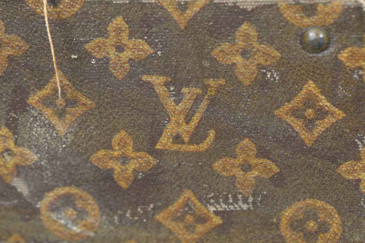 An early 20th century Louis Vuitton travelling trunk with overall monogram canvas covering and tan - Image 34 of 42