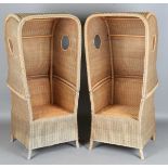 A pair of 20th century woven wicker hooded porters' chairs, height 155cm, width 73cm, depth 69cm.
