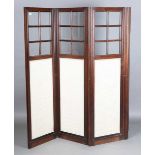 A late 19th century French rosewood three-division draught screen, inset with glass panels and