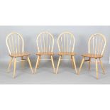A set of four mid-20th century beech and elm Ercol style hoop back kitchen chairs, height 85cm,