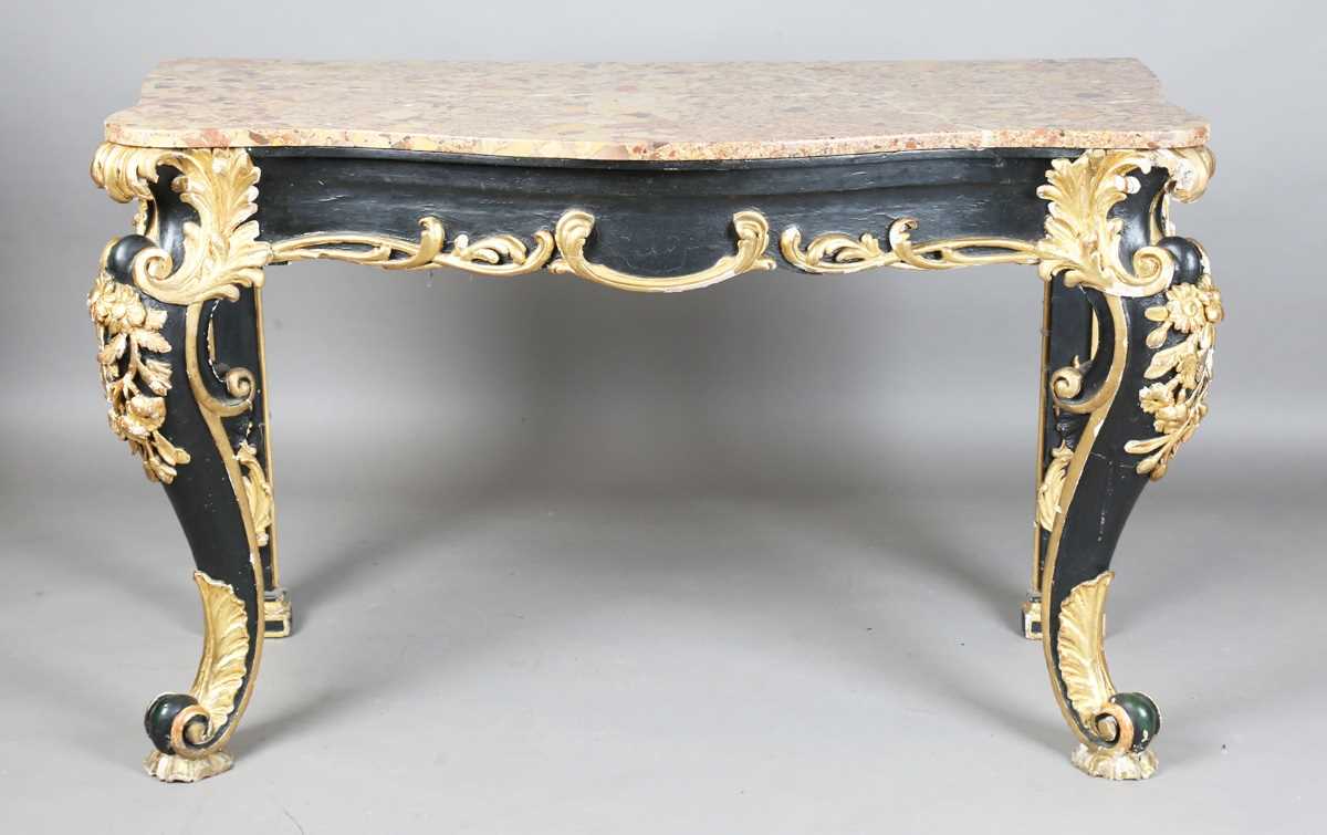 A 19th century Rococo Revival black painted and giltwood console table with a shaped Brèche d'Alep