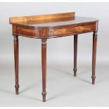 A Regency mahogany side table with line inlaid frieze panels, height 89cm, width 107cm, depth 54cm.