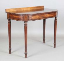 A Regency mahogany side table with line inlaid frieze panels, height 89cm, width 107cm, depth 54cm.