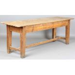 An early 20th century French pine kitchen serving table, on tapering block legs, height 76cm, length