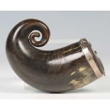 A 19th century Scottish horn snuff mull of typically curved form, fitted with a metal mounted