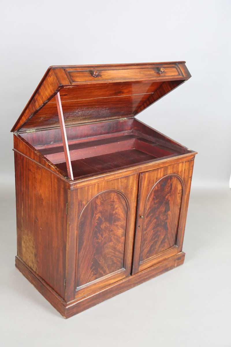 An early Victorian mahogany wash cabinet, fitted with a hinged lid above two arch panelled doors, - Image 9 of 14