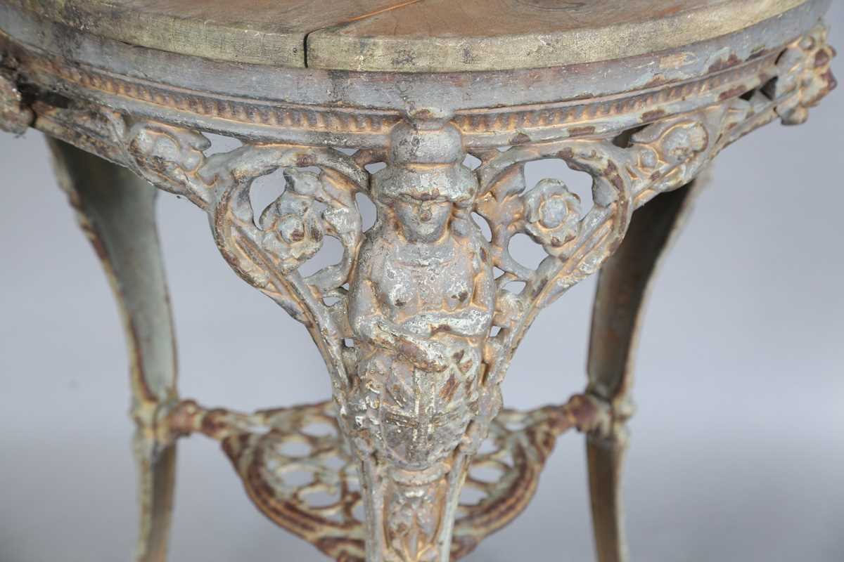 A Victorian cast iron pub table with a later wooden top and 'Britannia' legs, height 75cm, - Image 3 of 6