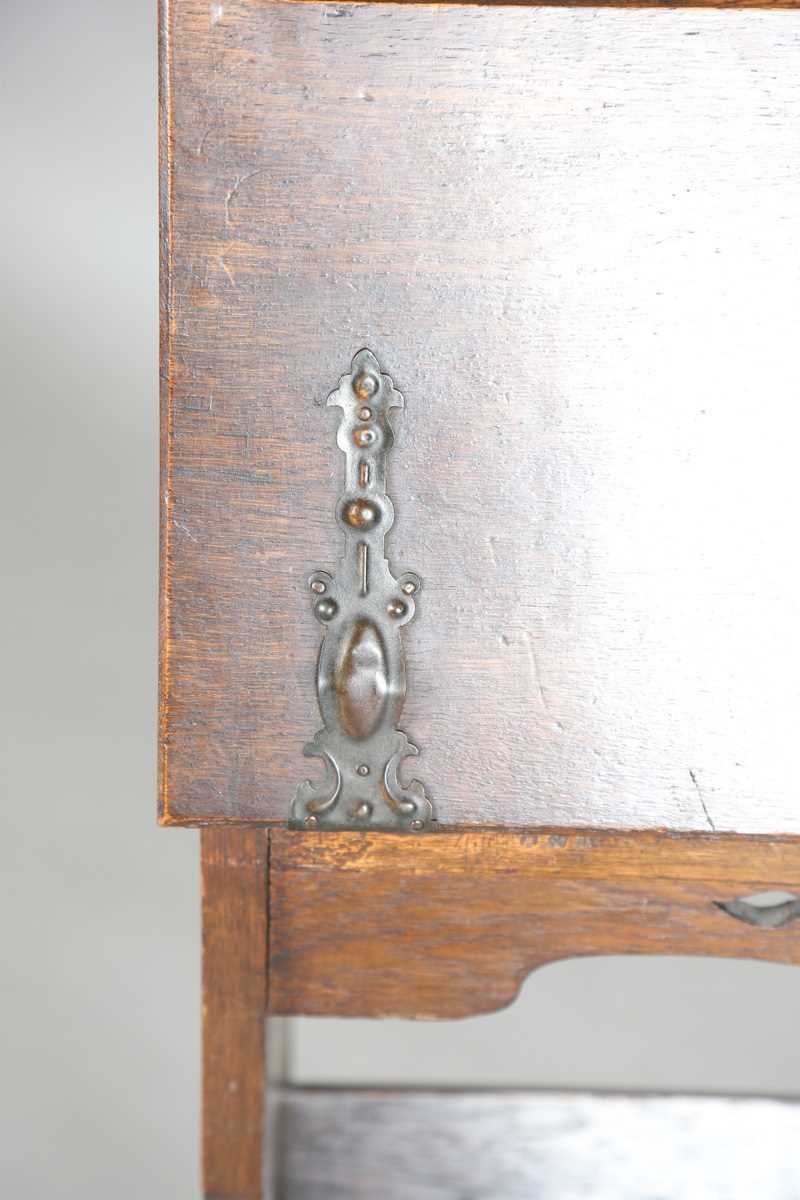 An early 20th century Arts and Crafts oak student's bureau, in the manner of Liberty & Co, height - Image 6 of 11