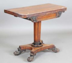 A Regency rosewood fold-over card table, raised on a quatrefoil base, height 73.5cm, width 92cm,