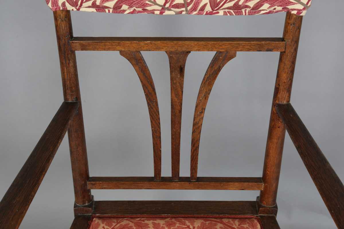 An Edwardian Arts and Crafts oak framed elbow chair, attributed to J.S. Henry, with later fitted - Image 4 of 11