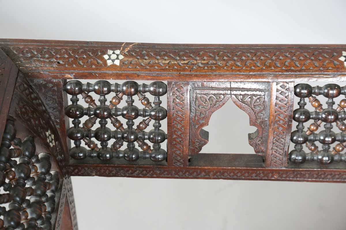 A late 19th century Middle Eastern hardwood and mother-of-pearl inlaid window seat, similar to those - Image 2 of 19