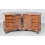 A pair of late 20th century reproduction mahogany serpentine fronted chests of drawers, height 78cm,