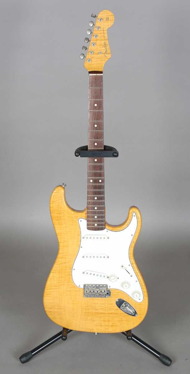 A Fender Stratocaster MIJ electric guitar, serial No. 5006278 (surface cracks to varnish).