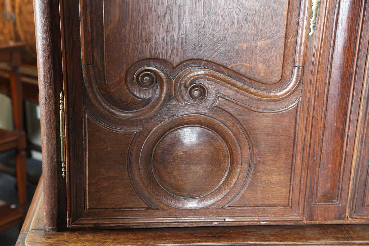 A 19th century French oak side cabinet with an arched pediment and four carved panel doors, height - Image 5 of 14