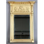 A Regency gilt composition pier mirror, the ball shot pediment above a boar-hunting scene and a