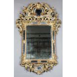 A late 19th century Rococo Revival giltwood sectional wall mirror with scrolling frame and
