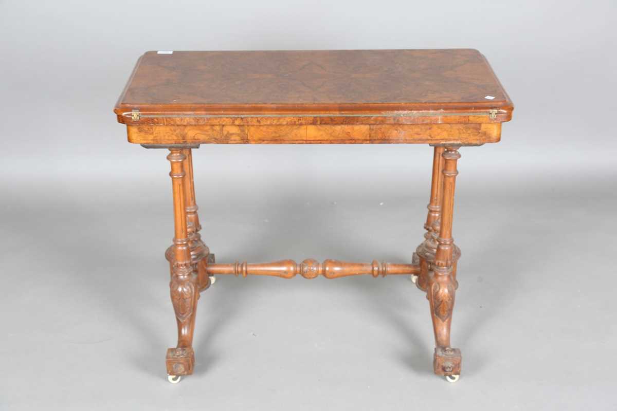 A mid-Victorian burr walnut rectangular fold-over card table, raised on fluted legs and carved feet, - Image 13 of 14