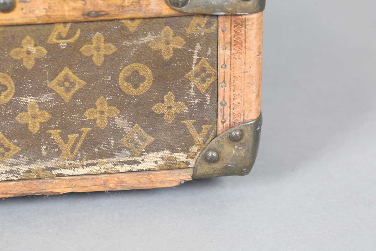 An early 20th century Louis Vuitton travelling trunk with overall monogram canvas covering and tan - Image 9 of 42