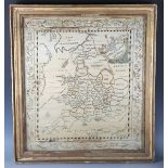A Regency silkwork map of England and Wales, finely worked with chenille borders, within a
