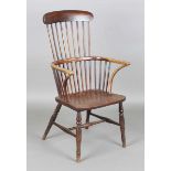 A late 19th century provincial ash and elm Windsor armchair with bar and stick back, height 111cm,