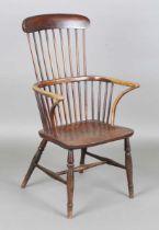 A late 19th century provincial ash and elm Windsor armchair with bar and stick back, height 111cm,