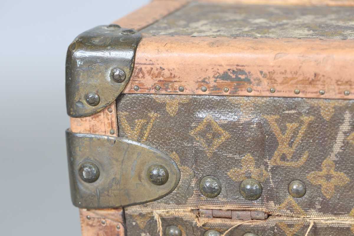 An early 20th century Louis Vuitton travelling trunk with overall monogram canvas covering and tan - Image 31 of 42