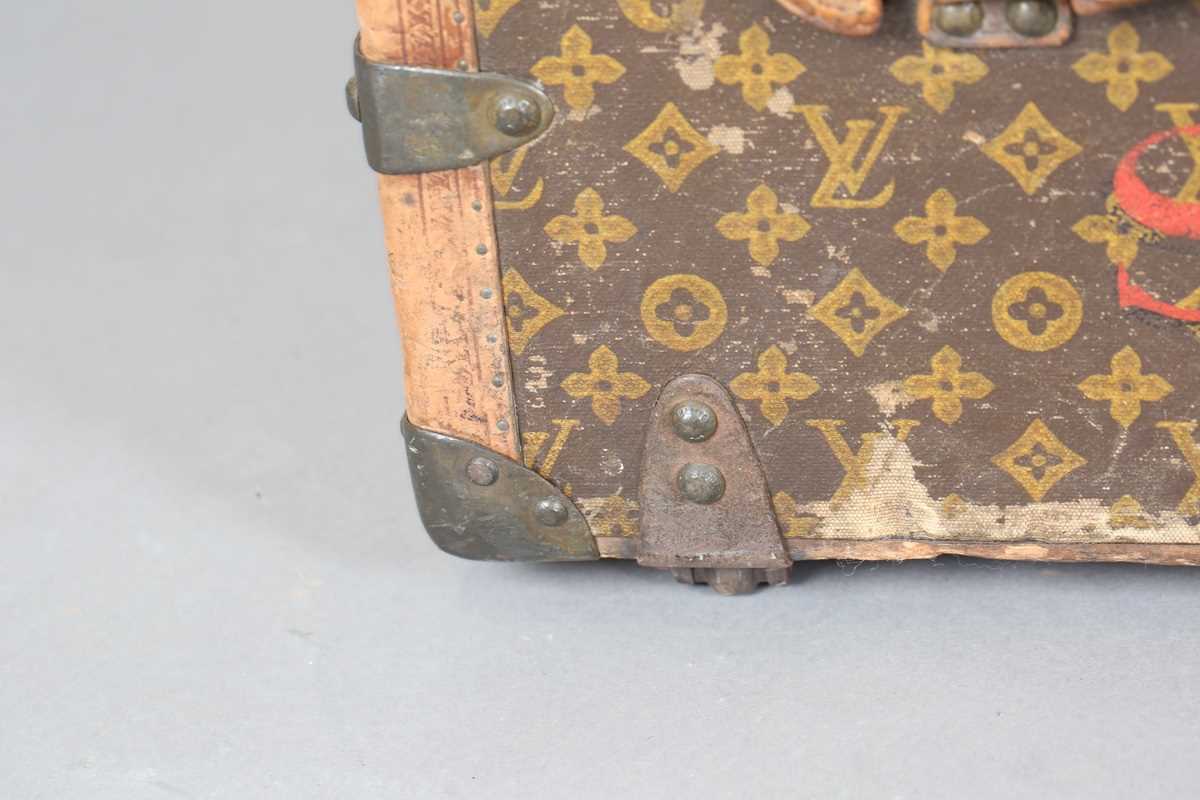 An early 20th century Louis Vuitton travelling trunk with overall monogram canvas covering and tan - Image 39 of 42