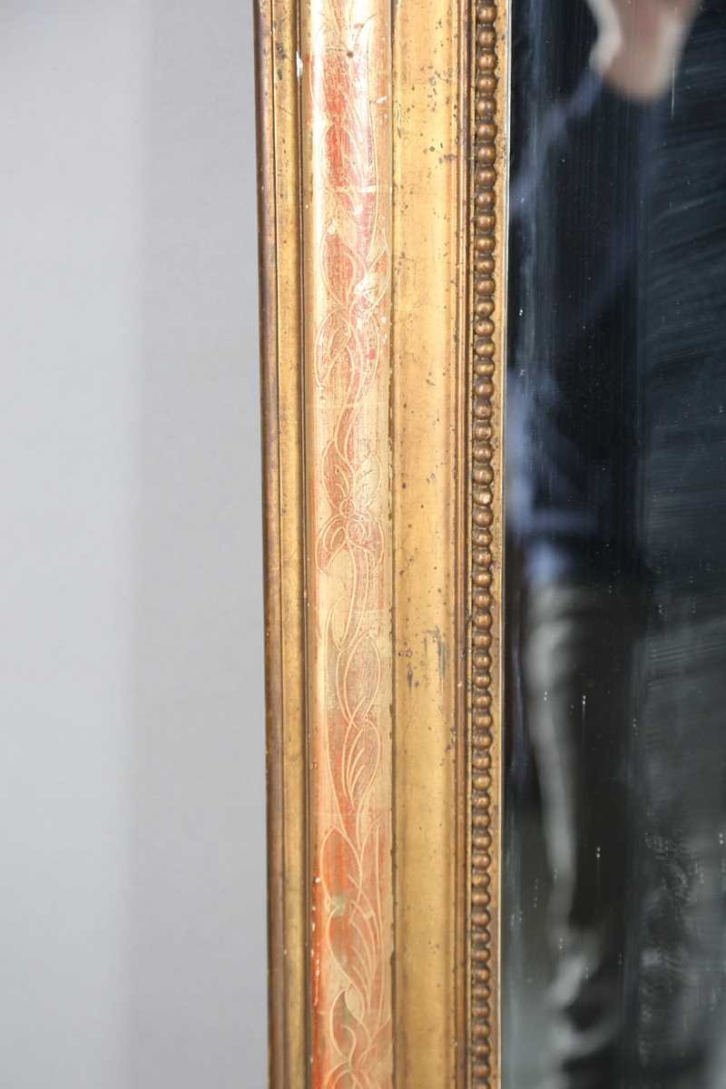 A 19th century French gilt gesso pier mirror with an arched foliate decorated frame, 138cm x 85cm. - Image 4 of 10