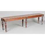 A Victorian mahogany hall bench, the long rectangular seat on turned legs, height 46cm, length