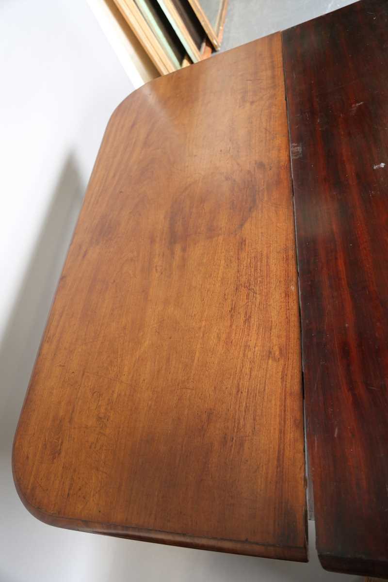 A William IV mahogany pull-out extending dining table, in the manner of Gillows of Lancaster, the - Image 7 of 13