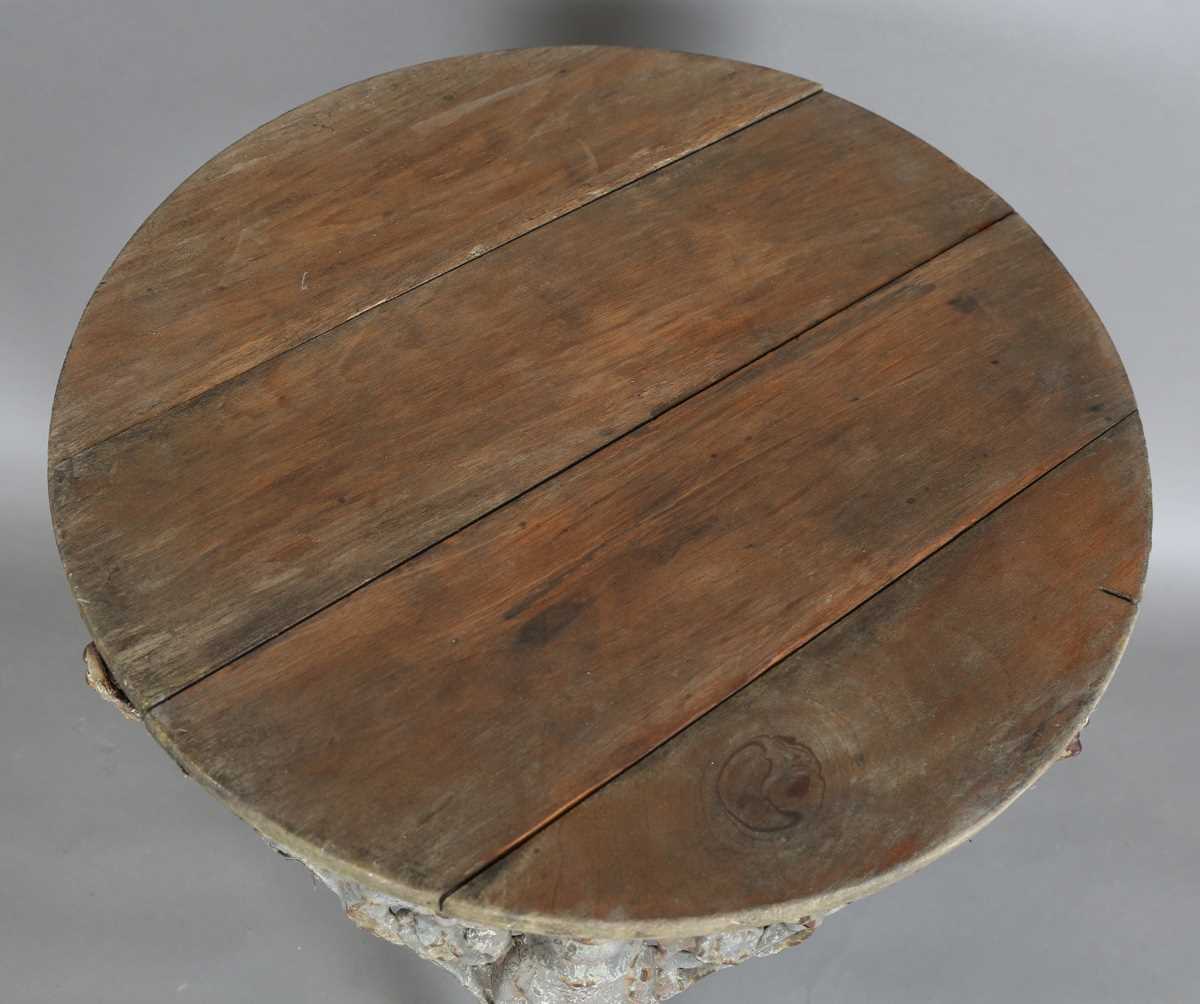 A Victorian cast iron pub table with a later wooden top and 'Britannia' legs, height 75cm, - Image 2 of 6
