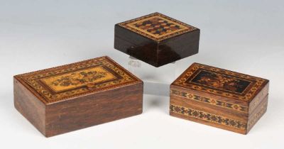 A Victorian Tunbridge ware square box, the lid with geometric cuboid panel, containing a wooden