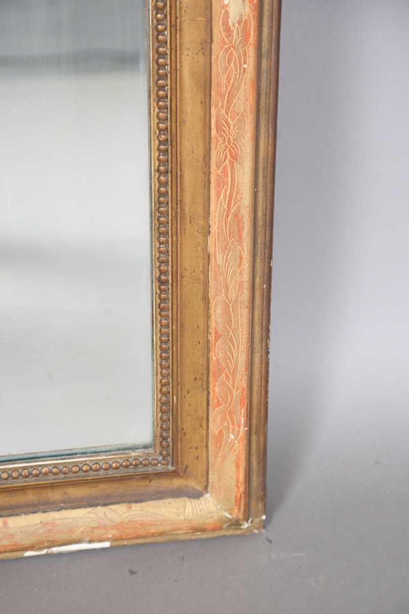 A 19th century French gilt gesso pier mirror with an arched foliate decorated frame, 138cm x 85cm. - Image 7 of 10