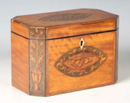A George III satinwood canted rectangular tea caddy, inlaid with two shell paterae and panels of