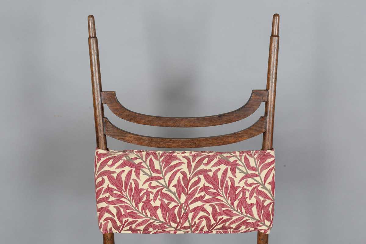 An Edwardian Arts and Crafts oak framed elbow chair, attributed to J.S. Henry, with later fitted - Image 2 of 11