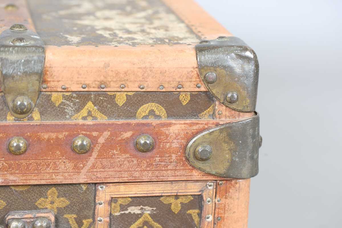 An early 20th century Louis Vuitton travelling trunk with overall monogram canvas covering and tan - Image 25 of 42
